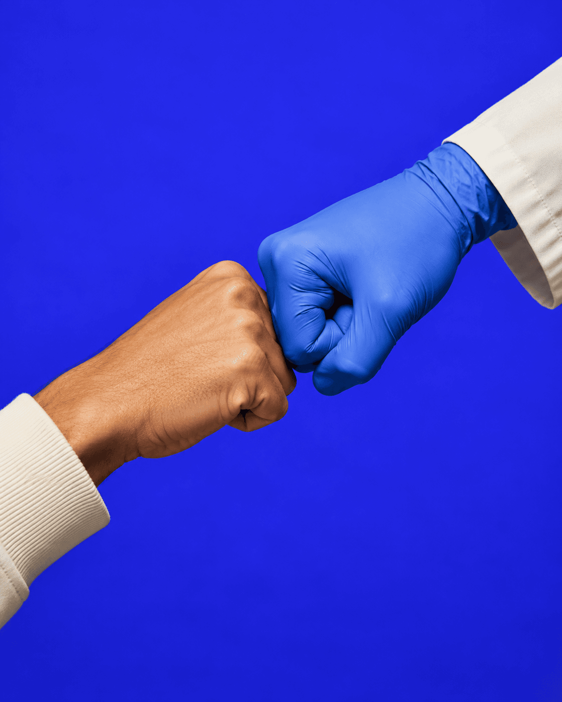 A clinician and a friend sharing a fist bump